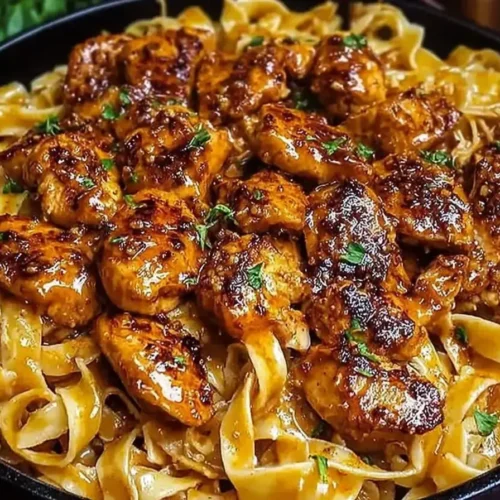 Creamy 25-Min Cajun Honey Butter Chicken Pasta, a spicy-sweet weeknight dinner finished with fresh herbs.